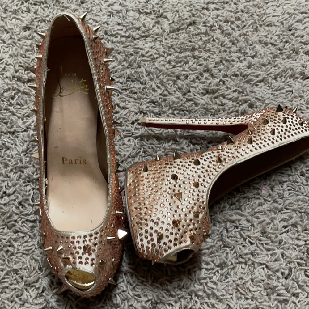 Gold spike Christian Louboutin heels.